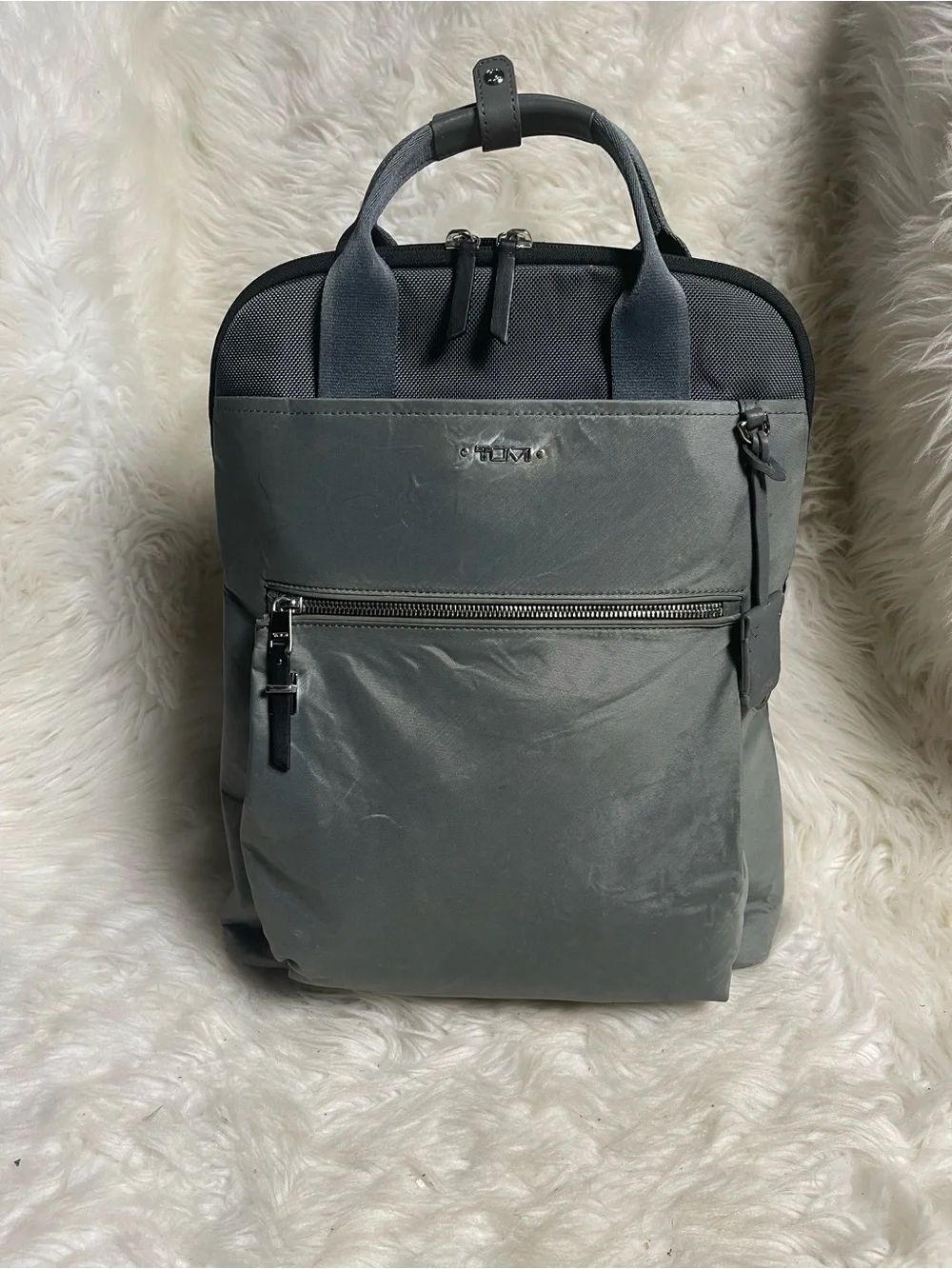 Tumi Voyageur Halsey nylon Gray Backpack with leather Top Handles.